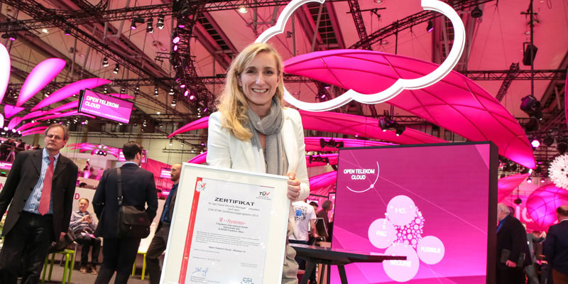 Handover of the certificate at the CeBIT: Anette Bronder, Digital Division Manager at T-Systems and in charge of cloud business, accepted the certificate presented by TÜV AUSTRIA Deutschland GmbH. (C) T-Systems